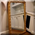 DM01. Large gilt mirror. 63"h x 33.5"w 
